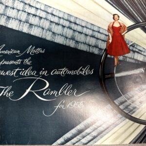 Vintage advertisement for The Rambler (1955) featuring a woman in a red dress perched on a large steering wheel with cursive text about the newest idea in automobiles.