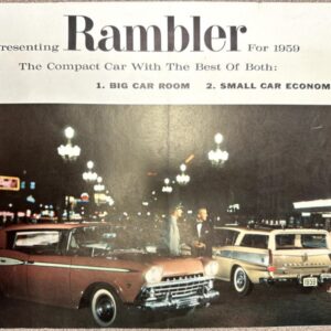 Night city street scene with vintage 1959 Rambler cars parked curbside and pedestrians nearby.