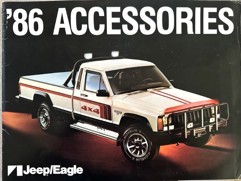 IMG_5578 | Merrick Auto Museum 1986 Jeep/Eagle accessories catalog cover with a white 4x4 pickup truck and bold '86 ACCESSORIES' text above.