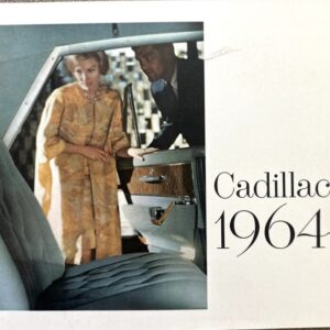 Inside view of a 1964 Cadillac: open door, blue leather seat and wood trim; a woman in a gold dress and a man lean in from outside.