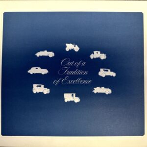 Blue background with white vintage cars arranged around the elegant script text: 'Out of a Tradition of Excellence'.