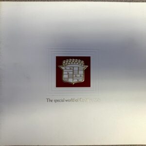 Cadillac crest centered on a red square with a layered white border; caption reads 'The special world of Cadillac 1973' below.