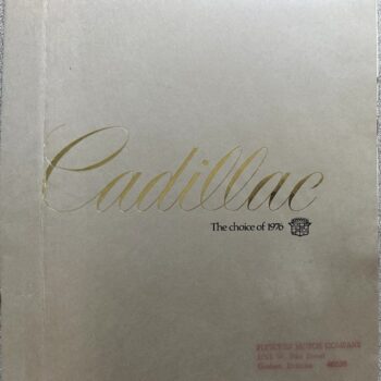 Cadillac brochure cover with gold script 'Cadillac' and the caption 'The choice of 1976' on a pale beige background, with a small crest.