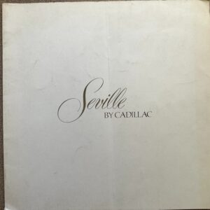 Cream cover with elegant script text reading 'Seville by Cadillac' centered on page, suggesting a Cadillac Seville booklet or brochure.