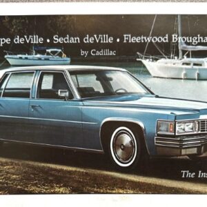 Blue Cadillac Coupe deVille parked on a beach with sailboats in the background; ad copy shows 'Coupe deVille • Sedan deVille • Fleetwood Brougham by Cadillac' and 'The Inside Story…'