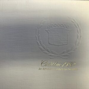 Cadillac 1980 brochure cover with embossed crest inside a laurel wreath and gold text reading 'Cadillac 1980 An American standard for the world.'