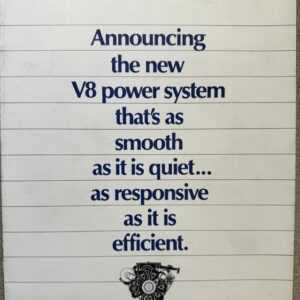 Poster promoting the new V8 power system as smooth, quiet, responsive, and efficient, with a small engine icon at the bottom.