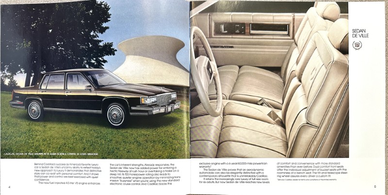 IMG_5818 | Merrick Auto Museum Two-page spread: exterior photo of a black Cadillac Sedan DeVille on a grassy lawn with a large white sculpture in the background; right page shows beige leather interior with front seats, steering wheel, and dashboard.