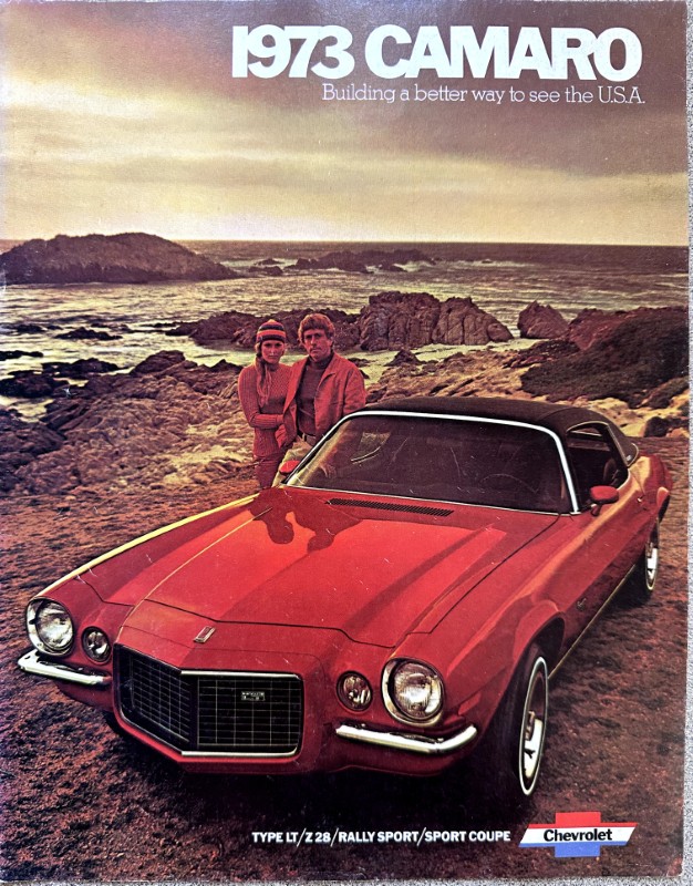 IMG_5918 | Merrick Auto Museum Vintage 1973 Camaro magazine cover showing a red convertible on a rocky coastline with a couple standing nearby.