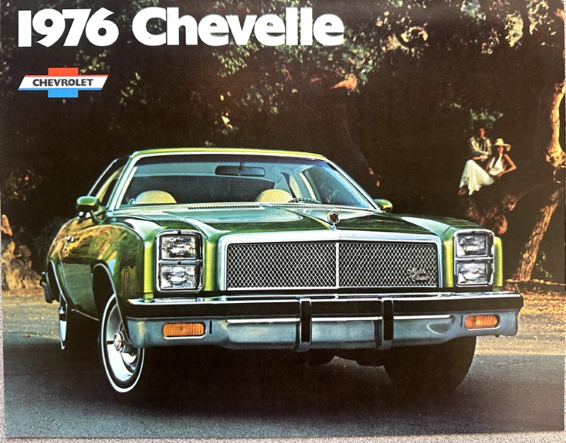 IMG_5989 | Merrick Auto Museum Front three-quarter view of a green 1976 Chevrolet Chevelle on a road, with a chrome grille; classic car brochure cover showing '1976 Chevelle' text and Chevrolet logo.