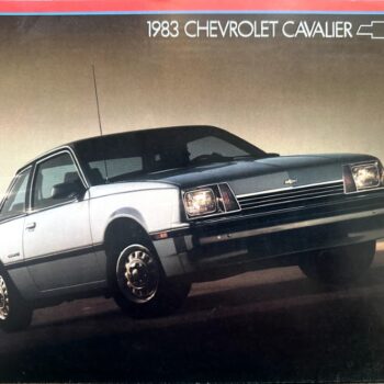1983 Chevrolet Cavalier brochure cover showing a silver front-left view of the car against a gradient sky.