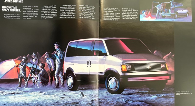 IMG_6096 | Merrick Auto Museum Silver van parked on a dusty lunar-like surface with campers, tents, and a telescope setup in the foreground.