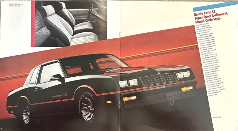 IMG_6117 | Merrick Auto Museum Two-page magazine ad for the Monte Carlo SS, showing a black coupe on a red backdrop with an interior shot in the top left and a dense text column on the right.