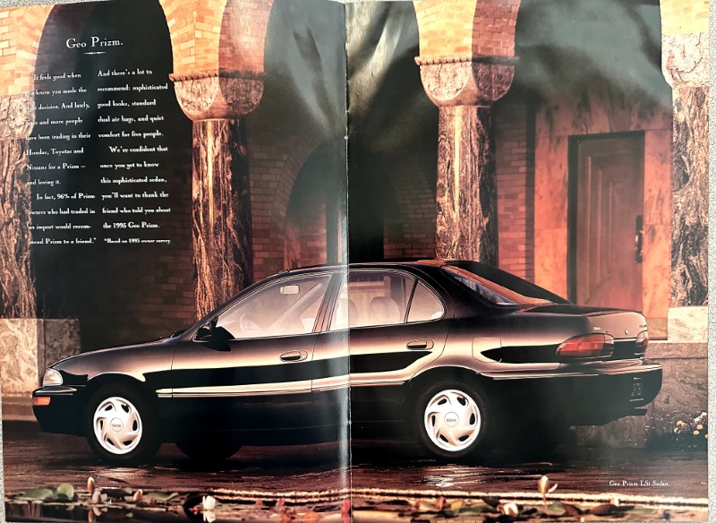 IMG_6220 | Merrick Auto Museum Black four-door sedan parked under stone arches in a Geo Prizm advertisement.