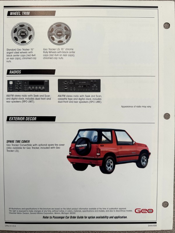 IMG_6231 | Merrick Auto Museum Car brochure page showing wheel trim options, car radios, and exterior decor, with a red Geo Tracker and spare tire cover.