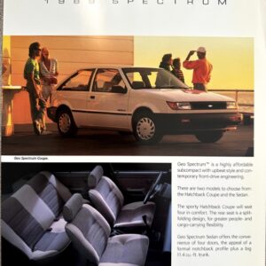 1989 Geo Spectrum brochure page showing a white Spectrum coupe on a deck with people in the background and an interior photo below.