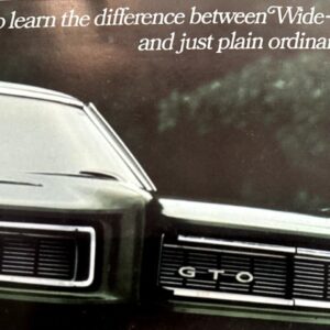 Front view of a vintage Pontiac GTO with its grille badge reading 'GTO' and a promotional headline about wide-tracking versus ordinary driving above.