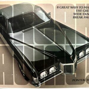 Top-down view of a glossy black 1969 Pontiac with chrome grille, from an ad that reads '8 Great Ways to Make the Great Wide-Track Break Away!' Pontiac '69.