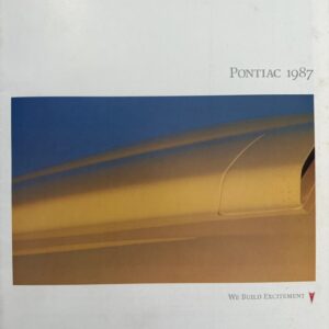 Pontiac 1987 brochure cover featuring a close-up of a gold car panel against a blue sky, with the slogan 'We Build Excitement'.