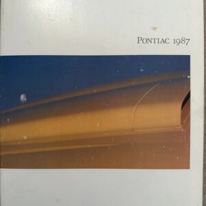 Cover of a 1987 Pontiac brochure showing a close-up of a yellow car body against a blue sky, with 'PONTIAC 1987' text in the top right.