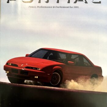 Red Pontiac sports car kicking up dust on a racetrack, featured in an advertisement with the headline 'PONTIAC' and the tagline 'Power, Performance & Excitement for 1991.'