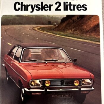 Red vintage Chrysler 2-litre car driving on a curved highway, with the 'Chrysler 2 litres' title at the top.