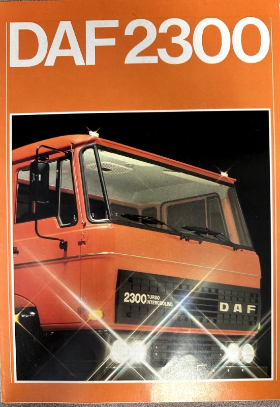 IMG_7297 | Merrick Auto Museum Orange DAF 2300 truck front view on a promotional brochure cover with headlights lit
