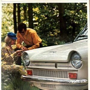 Vintage DAF 33 advertisement: white car front view with a man and woman in a wooded outdoor setting.