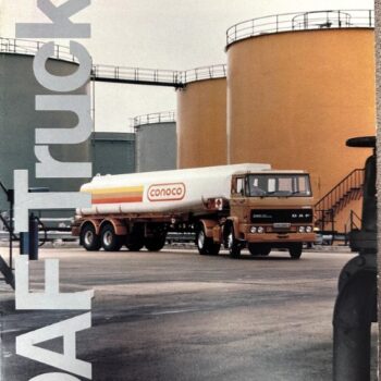 DAF fuel truck with Conoco tanker in an industrial storage yard beside large tanks.