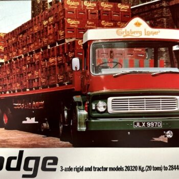 IMG_7352 | Merrick Auto Museum Red and green Dodge delivery truck loaded with stacked Carlsberg beer crates in an industrial yard showing Carlsberg branding on the cab