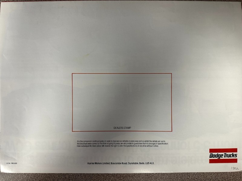 IMG_7357 | Merrick Auto Museum Blank dealer stamp sheet with a red-outlined rectangle in the center labeled DEALERS STAMP; Dodge Trucks logo in the bottom-right corner.