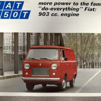 IMG_7388 | Merrick Auto Museum Red Fiat 850T panel van driving on an urban street; advertisement shows the Fiat 850T logo and copy about a 903 cc engine.
