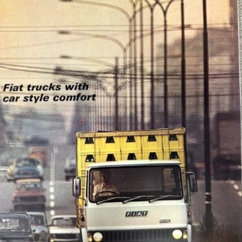 Front view of a Fiat 90NC truck driving toward the camera on a highway; ad text reads 'Fiat 90NC' and 'Fiat trucks with car style comfort'.