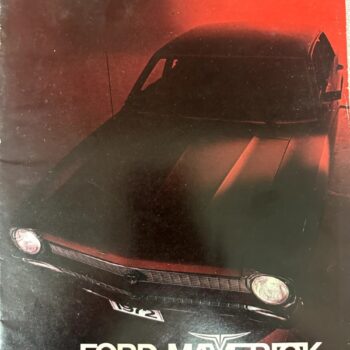 Front three-quarter view of a Ford Maverick in a red-lit studio, with the model name 'FORD MAVERICK' at the bottom.