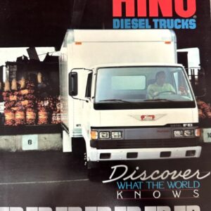 White Hino diesel truck at a loading dock with pallets in the background, advertising slogan 'Discover What the World Knows'.