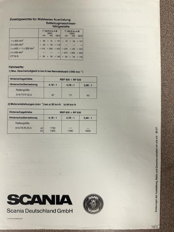 IMG_8529 | Merrick Auto Museum German technical data page with tables of rear axle gear ratios and tire sizes, from a Scania document; includes Scania logo at bottom.