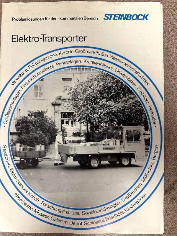 IMG_8562 | Merrick Auto Museum Cover of a Steinbock Elektro-Transporter brochure featuring a vintage truck with a trailer, framed by a blue circular ring of text.