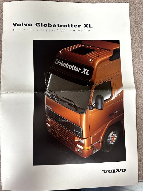 IMG_8697 | Merrick Auto Museum Orange Volvo Globetrotter XL truck brochure featuring a close-up of the cab, with Volvo logo on the bottom right and 'Globetrotter XL' text on the windshield top edge.