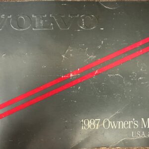 Volvo 740 1987 Owner's Manual cover for USA & Canada, dark cover with two red diagonal stripes.