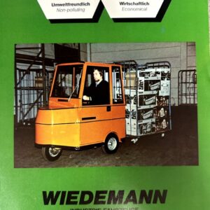 Green Wiedemann industrial equipment brochure featuring an orange electric forklift pulling a rack of boxed goods in a warehouse setting.