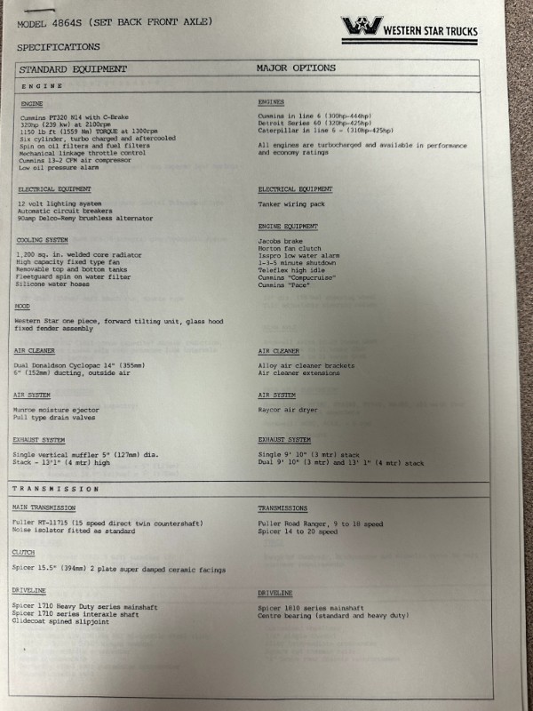 IMG_8740 | Merrick Auto Museum Specification sheet for MODEL 4864S (set back front axle) from Western Star Trucks, listing standard equipment and major options across engine, electrical, cooling, air system, exhaust, and transmission.