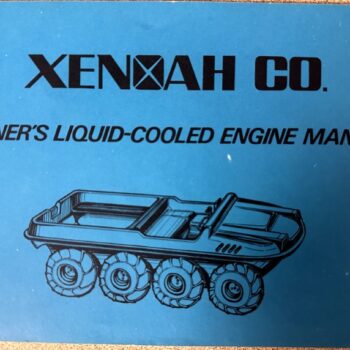 IMG_8749 | Merrick Auto Museum Blue manual cover with bold 'XENNAH CO.' and subtitle 'Owner's Liquid-Cooled Engine Manual' and a line drawing of a six-wheeled tracked vehicle below it.