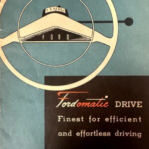 Vintage Ford advertisement featuring a circular steering wheel emblem over a blue background, with the text 'Fordomatic Drive' and the slogan 'Finest for efficient and effortless driving'.