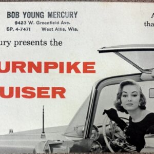 Vintage Mercury ad for the XM-TURNPIKE CRUISER showing a woman driver in a car with the rear hatch open and bold red headline XM-TURNPIKE CRUISER, suggesting a futuristic car.