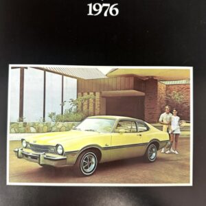 Mercury Comet 1976 cover; a yellow 1976 Mercury Comet parked outside a modern building with a couple standing nearby.