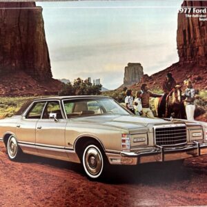 Beige 1977 Ford LTD in a desert canyon scene with people on horseback in the background.
