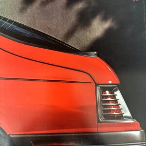 Red Mercury Capri ’85 rear quarter panel with taillight, set against a dark background; the cover shows 'MERCURY CAPRI' and '’85'.
