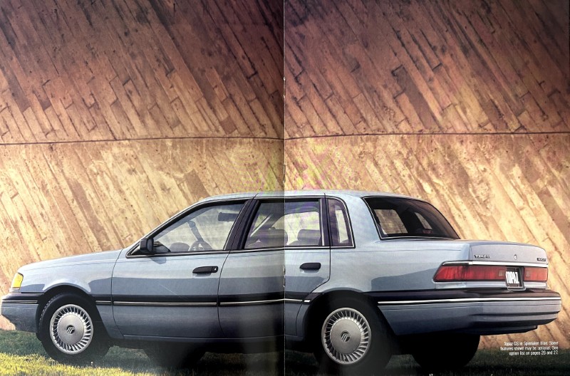 IMG_9106 | Merrick Auto Museum Two-panel collage of a light-blue four-door sedan parked on grass against a tall brown stone wall.