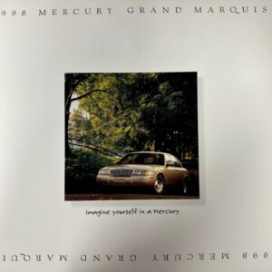 Gold 1998 Mercury Grand Marquis parked in a tree-lined park, within a bordered ad reading 'Imagine yourself in a Mercury'.