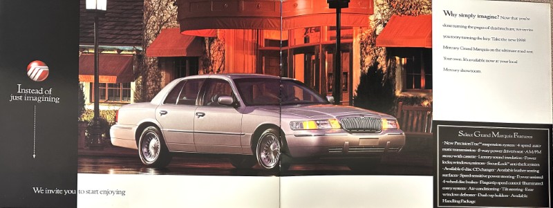 IMG_9130 | Merrick Auto Museum Silver Mercury Grand Marquis on a two-page car ad spread with red canopies and promotional text panels nearby.